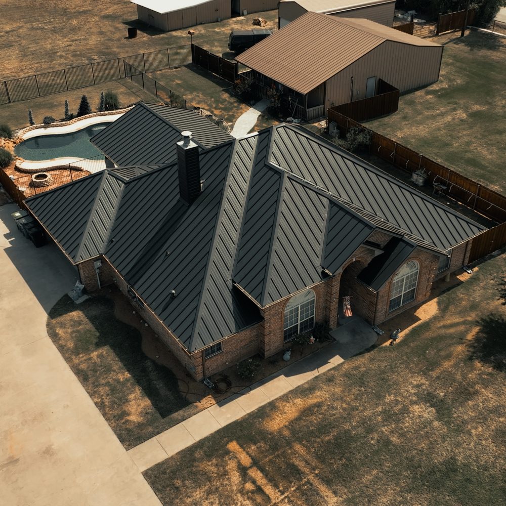 Commercial roofing repair crew securing edge metal and flashings